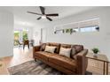 Bright living room featuring neutral walls, ceiling fan, and a dining area view at 2802 21St W St, Bradenton, FL 34205