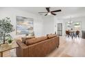 Cozy living room with modern decor, a ceiling fan, and wood-look flooring at 2802 21St W St, Bradenton, FL 34205