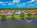 Enjoy the view from above of this gorgeous home with a screened-in pool located on the water at 2875 Grazeland Dr, Sarasota, FL 34240