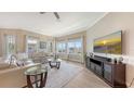 Bright living room with plush seating, a large windows and a view to the outside at 3430 77Th W St # 301, Bradenton, FL 34209