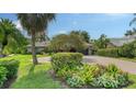 Beautiful home with brick driveway and meticulously manicured landscaping at 4761 Pine Harrier Dr, Sarasota, FL 34231