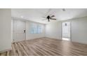 Bright living room featuring a new front door, wood floors, and neutral walls for a clean, modern aesthetic at 5438 Potter St, Sarasota, FL 34232