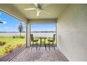 Cozy patio with comfortable seating and stunning lake views to enjoy outdoor living at 6612 Silverstar Dr, Sarasota, FL 34240