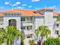 Exterior of condominium with balconies, landscaping, and a well-maintained facade at 1000 San Lino Cir # 1032, Venice, FL 34292