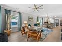 Open-concept living room features modern decor, stylish furniture, and lots of natural light at 112 17Th E St, Bradenton, FL 34208
