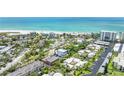 Aerial view of beach neighborhood, featuring the 3-story home with a rooftop deck at 119 Avenida Messina, Sarasota, FL 34242