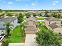 Aerial view of a home in a well maintained neighborhood with mature landscaping at 2118 Song Sparrow Ct, Ruskin, FL 33570