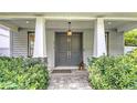 Stylish entrance features a double door, brick pathway and manicured landscaping at 2410 Prospect St, Sarasota, FL 34239