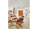 Spacious living area with tile floors, double doors, and ample natural light at 3764 Torrey Pines Blvd, Sarasota, FL 34238