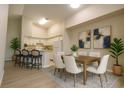 Bright dining area and kitchen with stainless steel appliances and breakfast bar, ideal for entertaining at 4140 Central Sarasota Pkwy # 1235, Sarasota, FL 34238