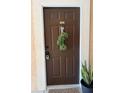 Inviting front door with wreath and decorative door hardware at 4140 Central Sarasota Pkwy # 1235, Sarasota, FL 34238