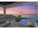 Enjoy sunsets from the balcony overlooking the pool and waterfront at 676 Regatta Way, Bradenton, FL 34208