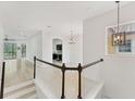 Bright entryway with light floors, staircase, and an open view of the living spaces at 8261 Miramar Way # 8261, Lakewood Ranch, FL 34202