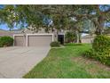 Charming home featuring a well-maintained lawn, an attached two-car garage and beautiful landscaping at 9927 58Th E St, Parrish, FL 34219