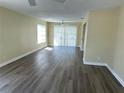 Inviting living room with lots of light and stylish, modern flooring at 201 Elliot Ave, Sarasota, FL 34232