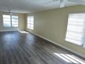 Spacious living room featuring contemporary flooring and an abundance of natural light at 201 Elliot Ave, Sarasota, FL 34232