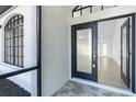 Light-filled entryway features tiled floors and a clear view of the living area at 234 Antofagasta St, Punta Gorda, FL 33983