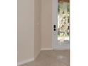 Entryway with a decorative glass front door, neutral walls, and tile flooring at 318 Winding Brook Ln # 104, Bradenton, FL 34212
