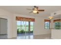 Bright living room featuring sliding glass doors to a patio and tile flooring at 318 Winding Brook Ln # 104, Bradenton, FL 34212