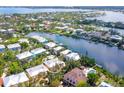 Beautiful aerial view of a luxury neighborhood with waterfront access and stunning landscaping at 3954 Hamilton Club Cir # 14, Sarasota, FL 34242