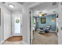 Inviting foyer with light-filled entry, stylish decor, and tile flooring at 529 Sunset N Rd, Rotonda West, FL 33947