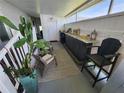 Inviting porch features a bar, seating, and a large potted cactus, creating a relaxing outdoor space at 5316 Chateau Ln, Bradenton, FL 34207