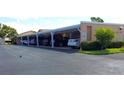 Covered parking area with assigned spaces, protecting vehicles from the elements and providing convenience for residents at 6132 29Th W Ave, Bradenton, FL 34209