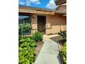 Inviting front entrance with beautiful landscaping around the doorway and a well-kept walkway to the home at 6132 29Th W Ave, Bradenton, FL 34209