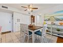 Charming dining area featuring a ceiling fan and a view of the kitchen at 618 Bird Bay S Dr # 113, Venice, FL 34285
