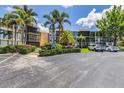 Well-maintained condo building with beautiful landscaping and ample parking at 618 Bird Bay S Dr # 113, Venice, FL 34285