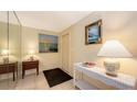 Inviting entryway featuring elegant decor, a mirrored wall, and tiled flooring at 626 46Th St, Sarasota, FL 34234