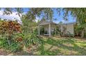 Charming single-story home with lush, tropical landscaping adding curb appeal to the property at 626 46Th St, Sarasota, FL 34234