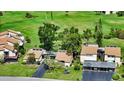 Birds-eye view of the community with beautiful landscaping and convenient parking at 718 White Pine Tree Rd # 80, Venice, FL 34285