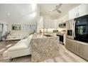 Modern kitchen with stainless steel appliances, granite countertops, and a bright, open design at 718 White Pine Tree Rd # 80, Venice, FL 34285