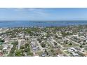 Expansive aerial view of neighborhood, showcasing proximity to water, lush greenery, and a serene environment at 7308 17Th W Ave, Bradenton, FL 34209