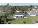 Backyard view featuring a lush lawn and chain link fence, offering privacy and space for outdoor activities at 7308 17Th W Ave, Bradenton, FL 34209