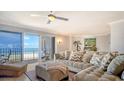Cozy living room with plush seating and a balcony overlooking the beautiful ocean view at 1 Benjamin Franklin Dr # 93, Sarasota, FL 34236