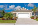 Charming single-Gathering home featuring well-maintained landscaping, healthy lawn, and a two car garage at 10177 Crystal Isle Cir, Sarasota, FL 34241