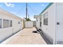 View of the mobile home's exterior, showcasing the storage shed, parking space, and well-kept surroundings at 10315 Cortez W Rd # 60-4, Bradenton, FL 34210