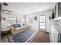 Cozy living room with a comfortable sofa, stylish rug, and bright natural light at 10315 Cortez W Rd # 60-4, Bradenton, FL 34210