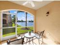 Relaxing screened patio featuring outdoor seating and scenic water views at 150 L Pavia Blvd # 13, Venice, FL 34292