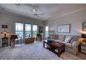 Inviting living room with water views, stylish furniture, and abundant natural light at 210 3Rd W St # 8308, Bradenton, FL 34205