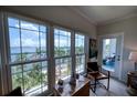 Bright room featuring large windows showcasing amazing waterfront views and access to the lanai at 210 3Rd W St # 8308, Bradenton, FL 34205