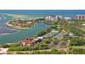 Scenic aerial view overlooking tennis courts, waterfront homes, and beautiful beaches at 225 Sands Point Rd # 6201, Longboat Key, FL 34228