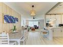 Bright and airy living room featuring a dining area and stylish decor at 237 Saxon Cir, Venice, FL 34293