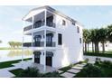 Stunning exterior featuring three floors, multiple balconies, and large, black-framed windows at 312 Avenida Leona, Sarasota, FL 34242