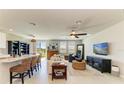Bright, open-concept living room featuring stylish furnishings and ample natural light at 7160 Amelia River Dr, Parrish, FL 34219