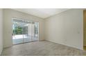 Light and airy living room area with a view of the lanai at 8239 Cypress Hollow Dr, Sarasota, FL 34238