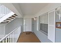 Inviting condo entrance with a 'Welcome' mat, window, and white railing at 1319 Perico Point Cir, Bradenton, FL 34209