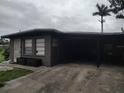 Exterior view of a single-story home with an attached carport at 1423 17Th E Ave, Bradenton, FL 34208